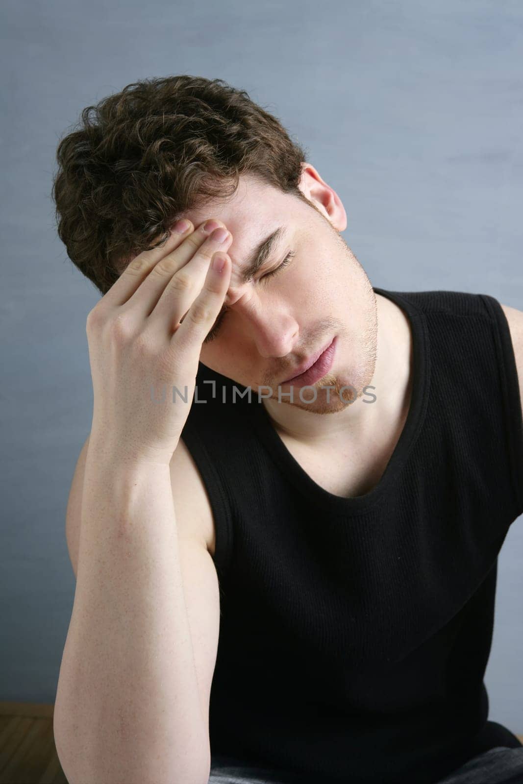 worried gesture pain young man stressed headache portrait