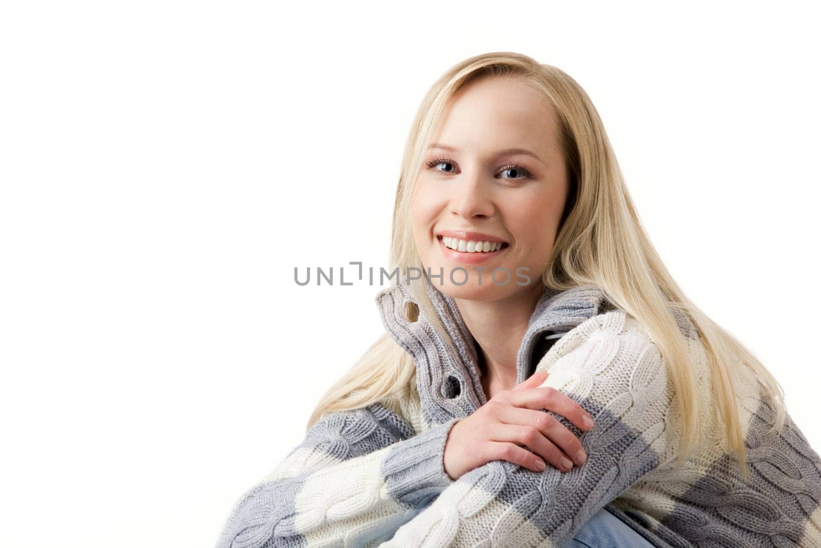 Portrait of blond female looking at camera and laughing