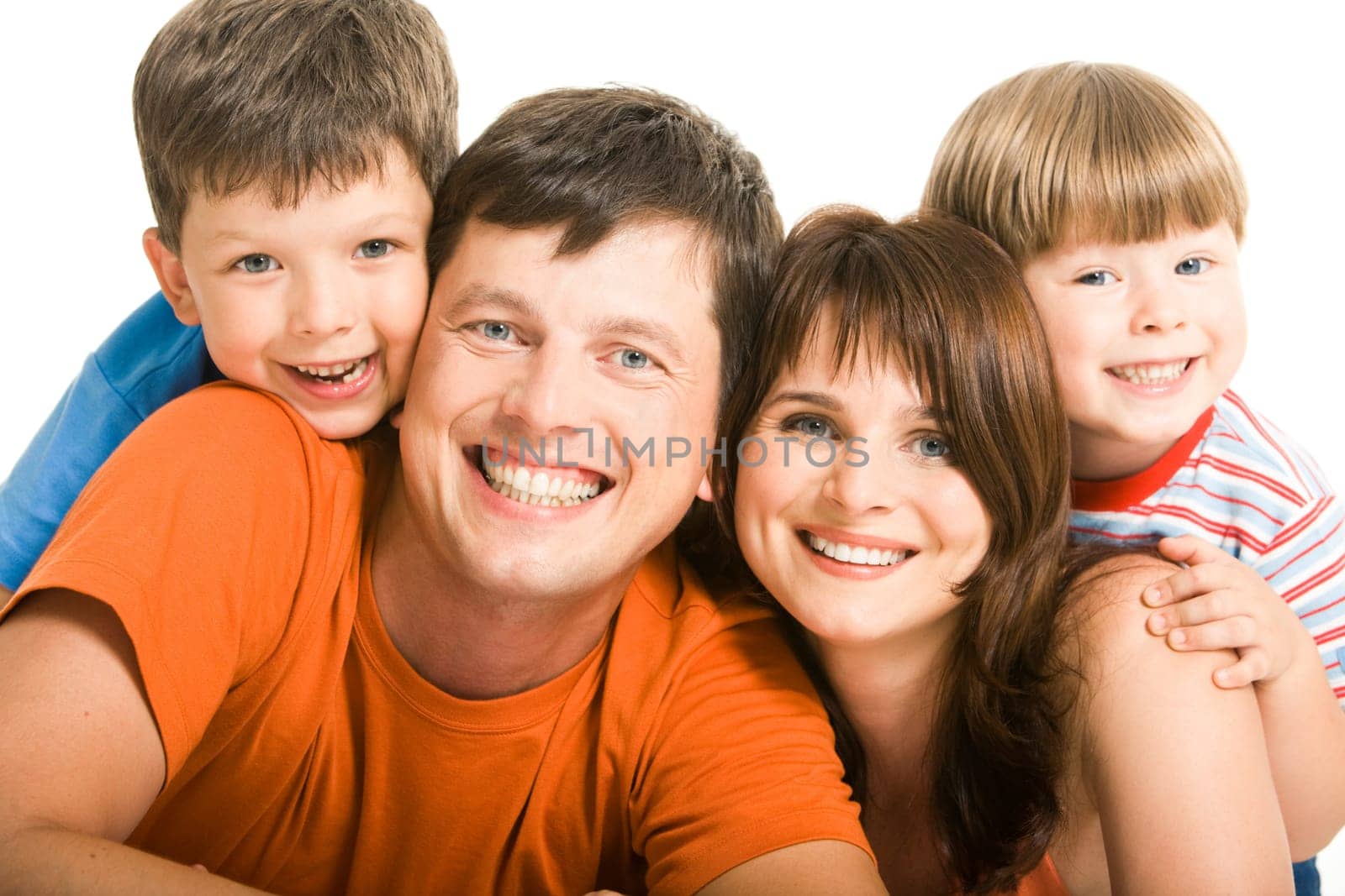 Portrait of joyful family laughing and looking at camera on white background