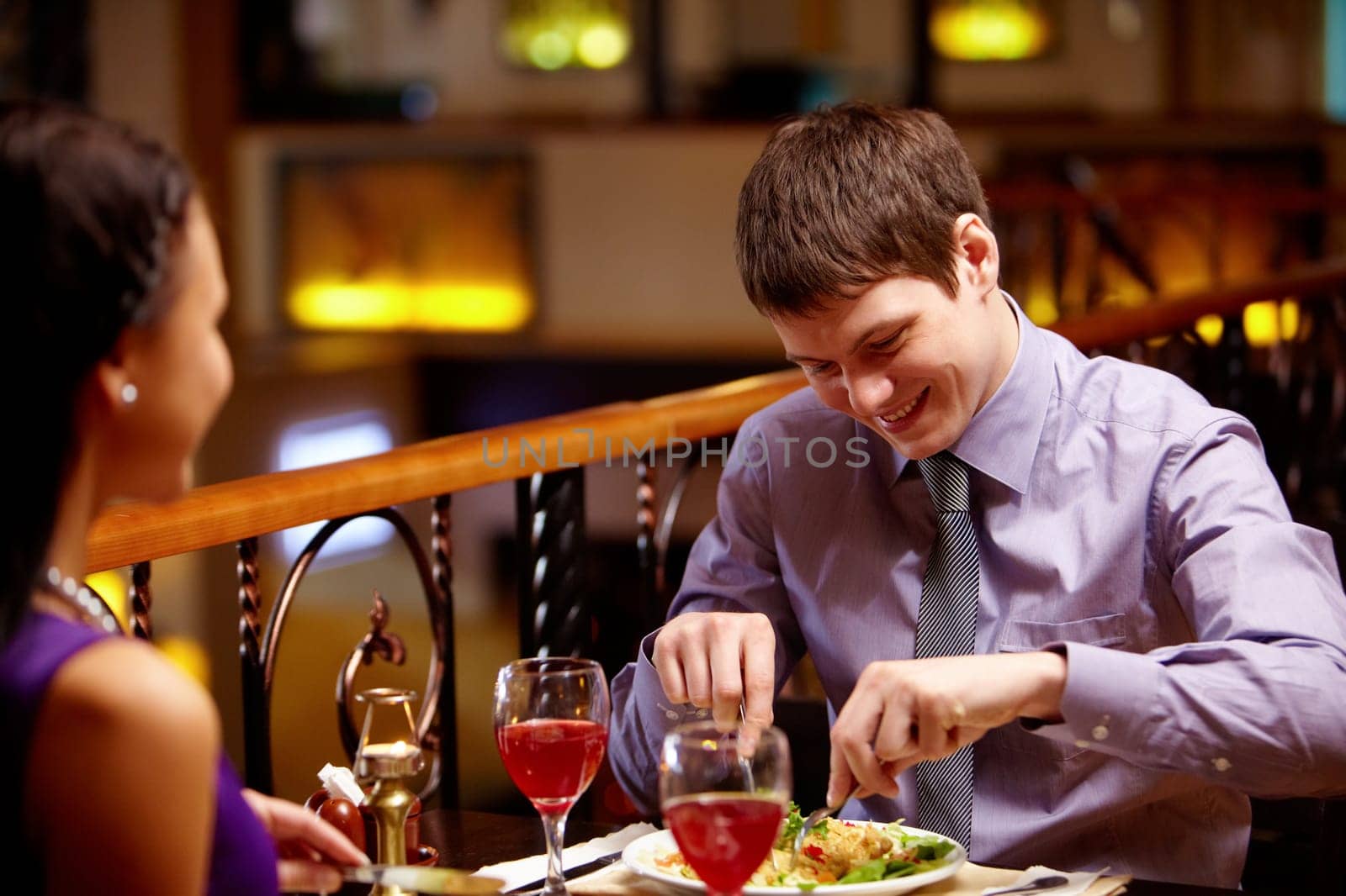Portrait of couple eating dish in the restaurant