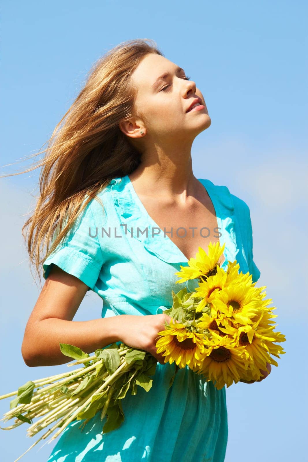 Photo of pretty girl with bouquet of sunflowers enjoying summer day