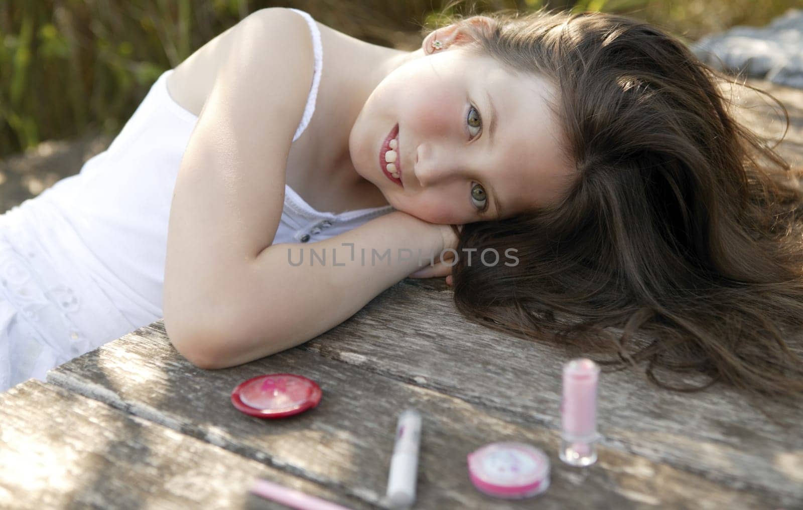 beautiful young girl portrait with make up set outdoors, at the park
