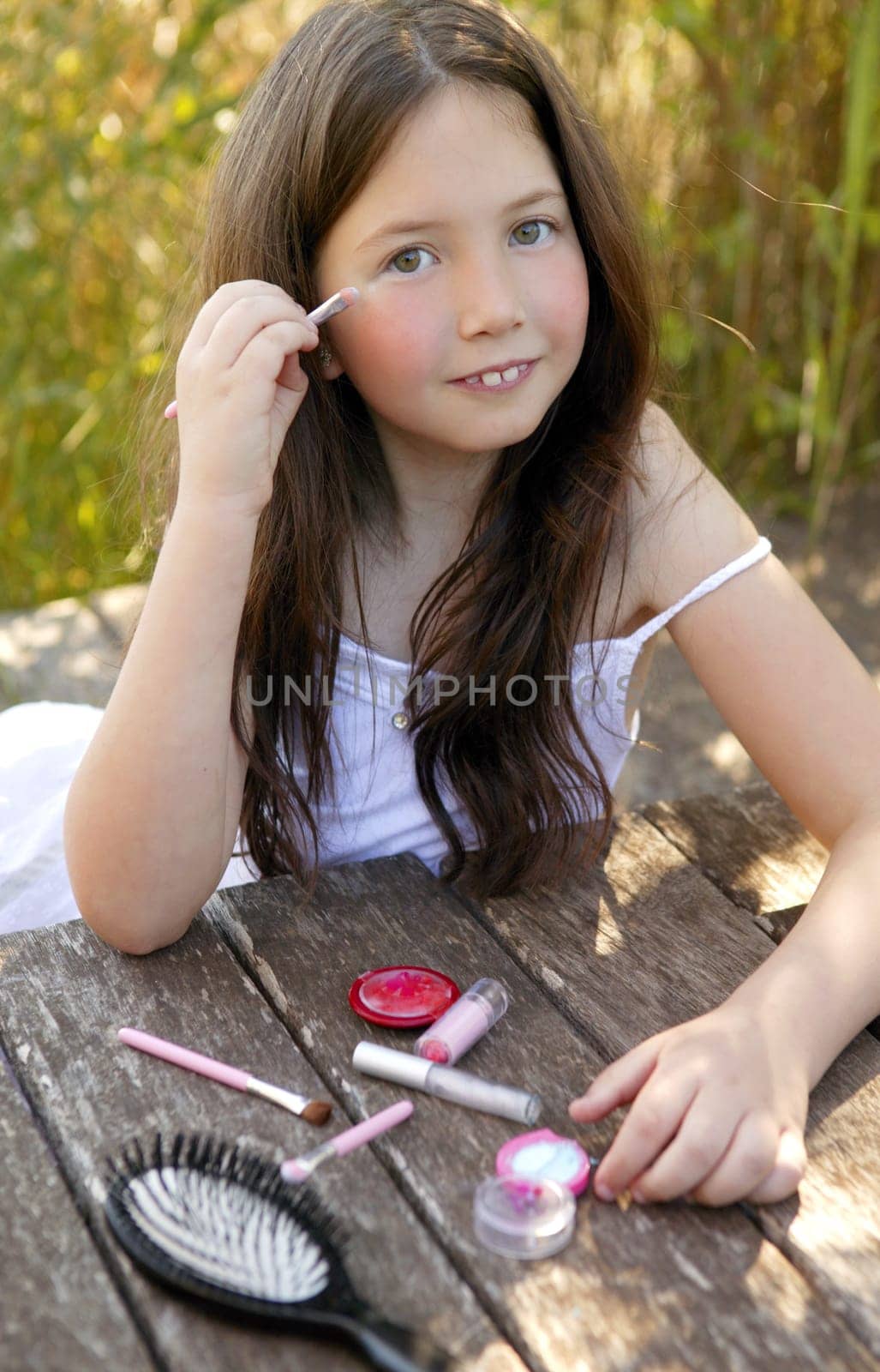 beautiful young girl portrait with make up set outdoors, at the park