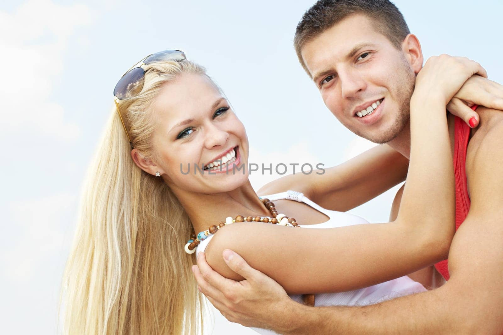 Portrait of a beautiful couple looking at camera and smiling