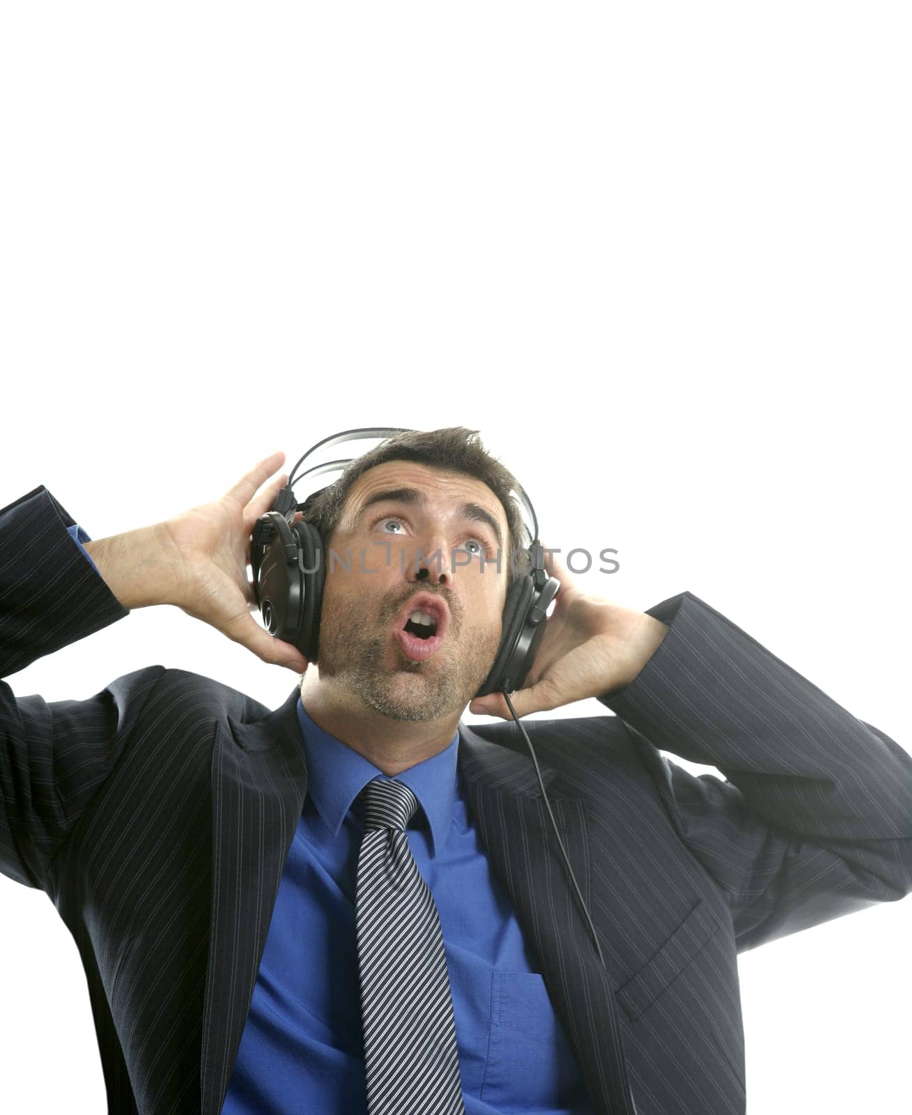 Businessman hearing and singing music with headphones, take a break