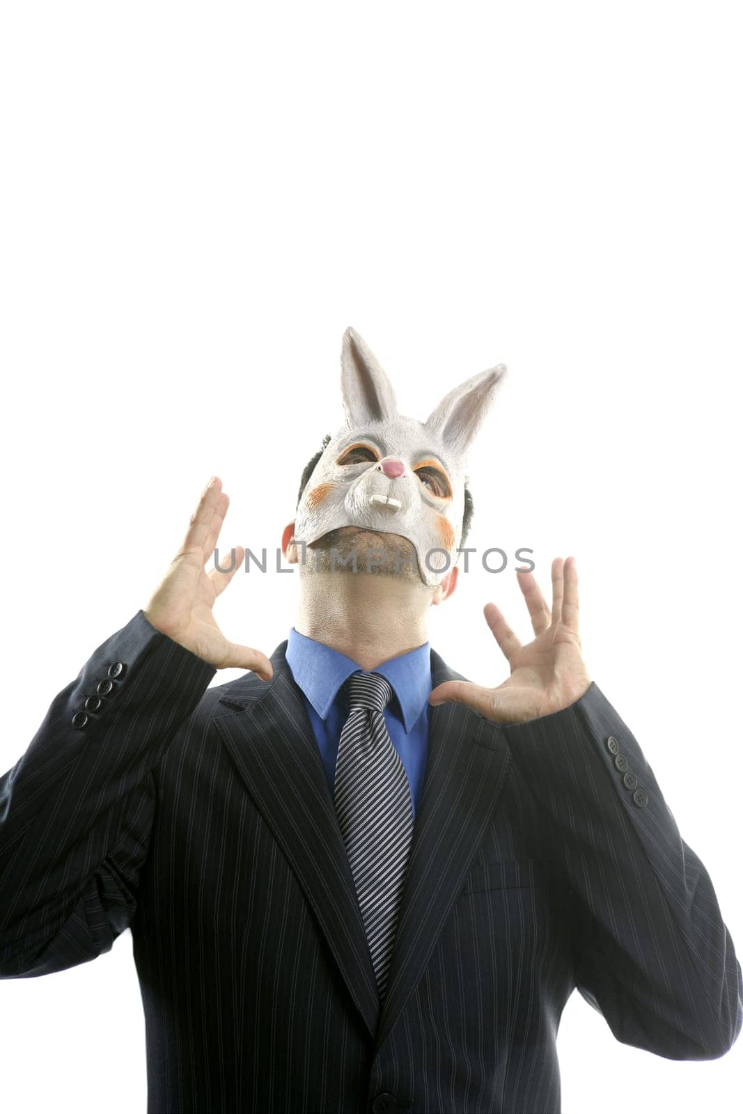 Businessman with funny rabbit mask over white studio background