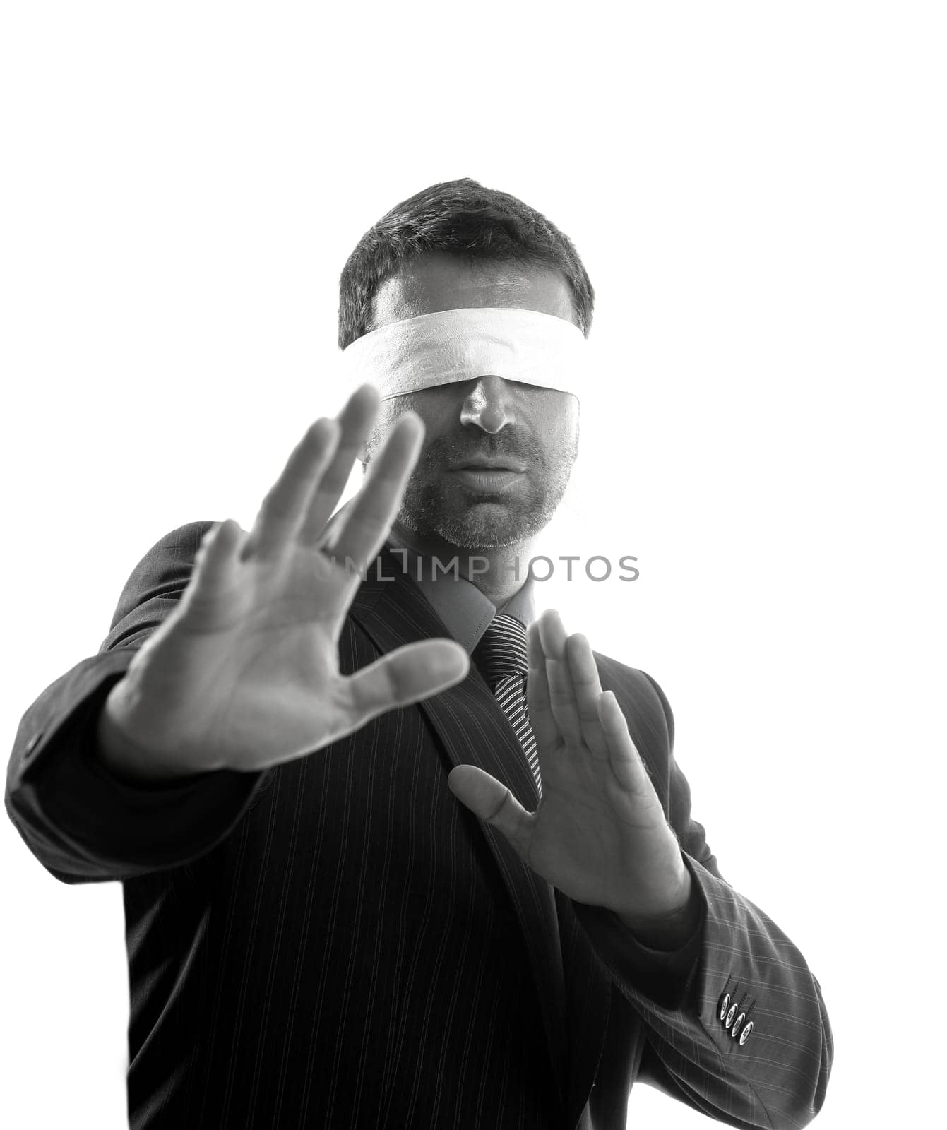 Blindfolded businessman over white background, defense martial arts