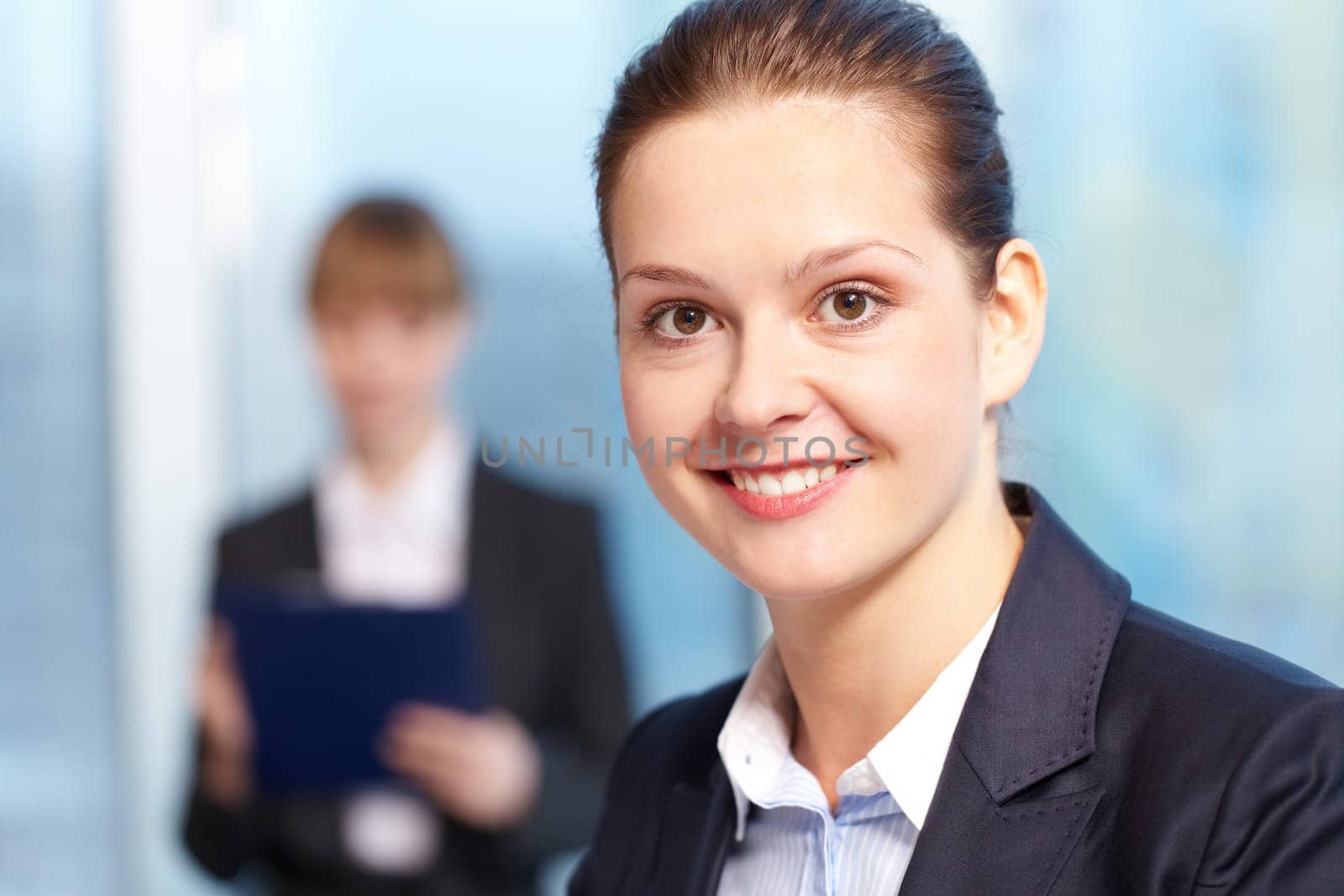 Close-up of young smiling businesswomans face