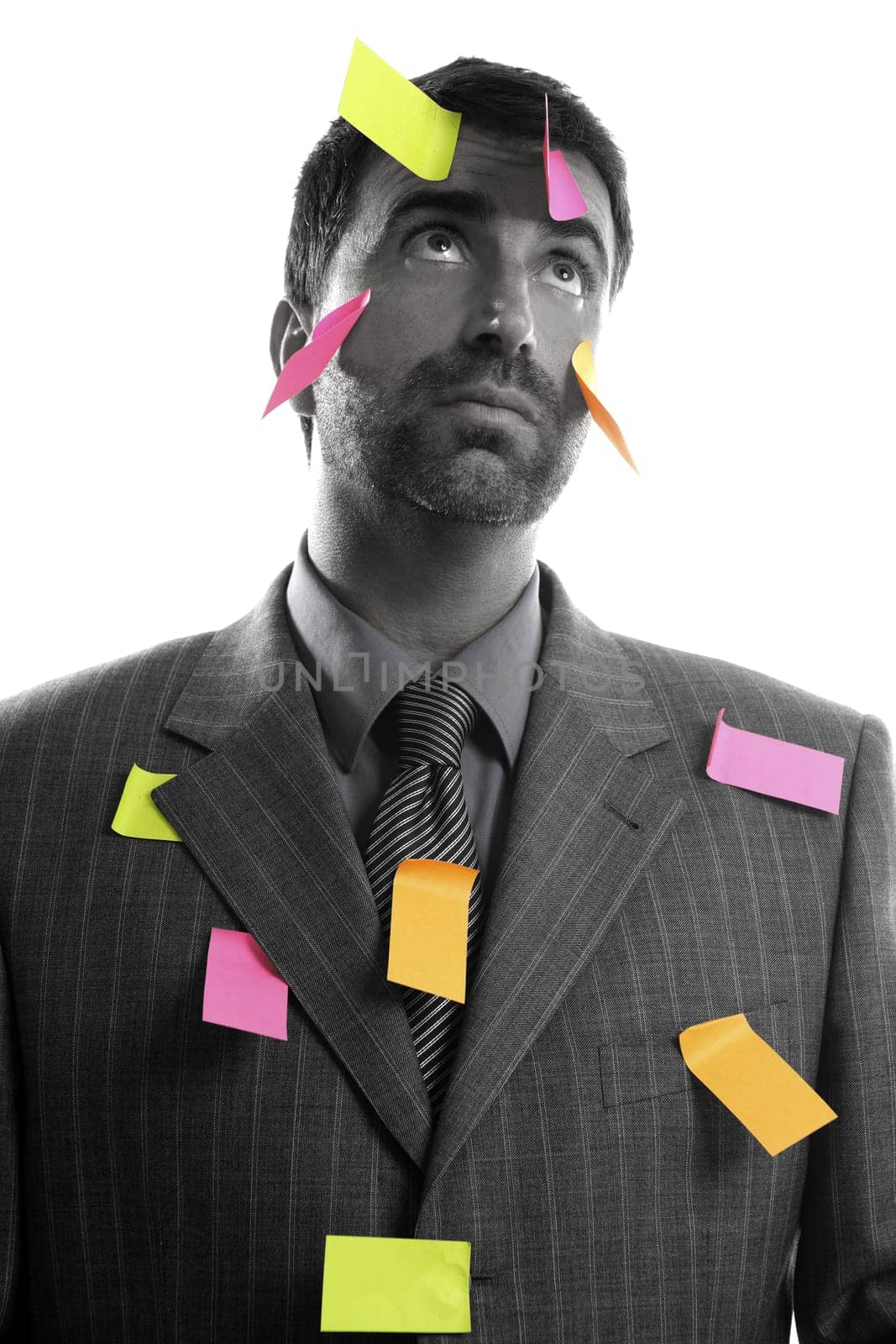 Businessman full of memo stock message notes over white studio background