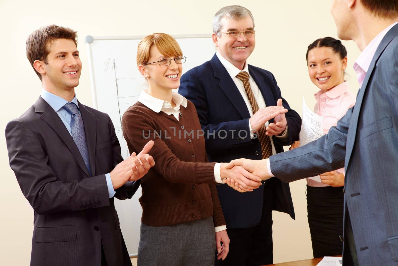Image of successful handshake after business training