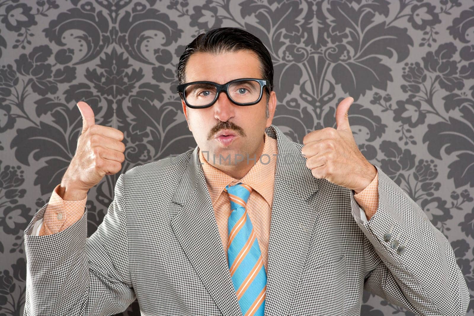 nerd businessman gesturing ok positive with hand over retro wallpaper