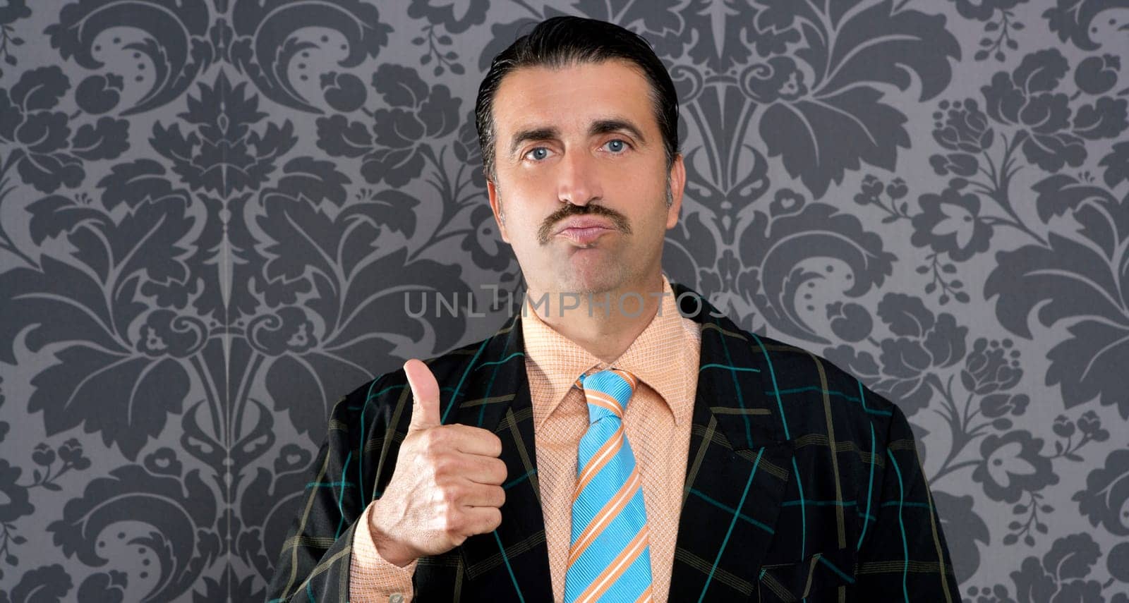 nerd businessman gesturing ok positive with hand over retro wallpaper