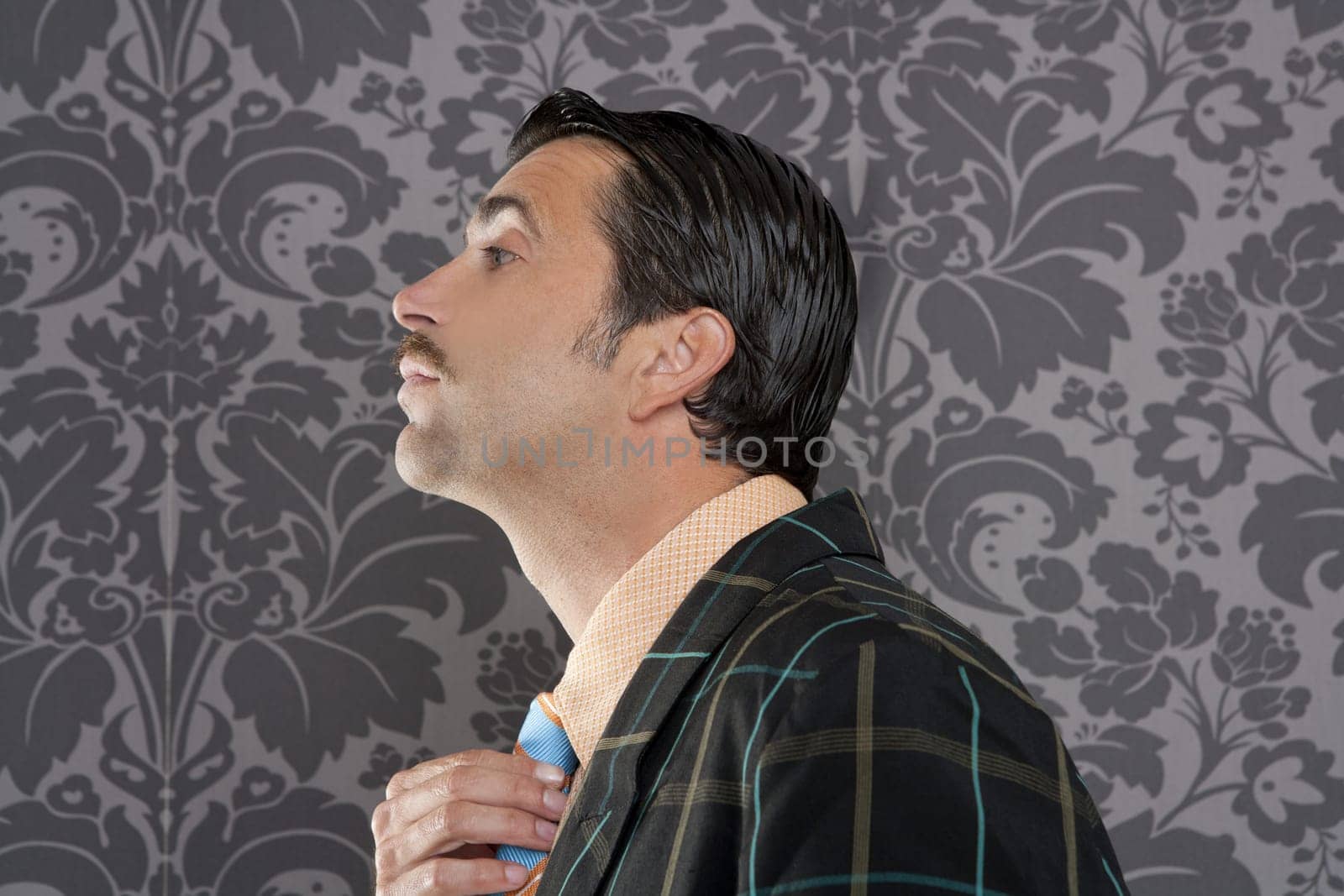 Nerd retro vintage businessman profile portrait mustache fixing neck tie