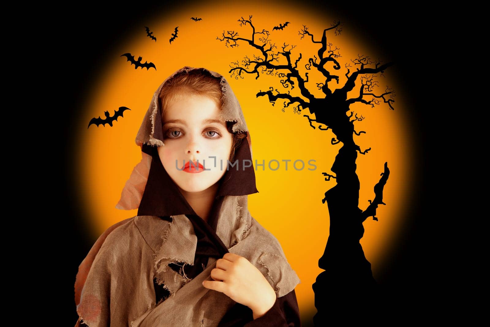 Halloween chil girl with grunge dress on orange backround