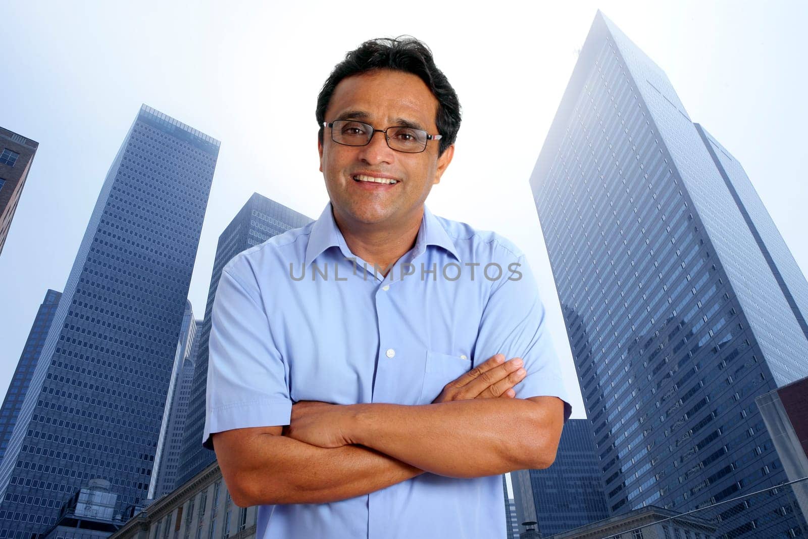 american indian businessman on a downtown urban city skyscraper buildings
