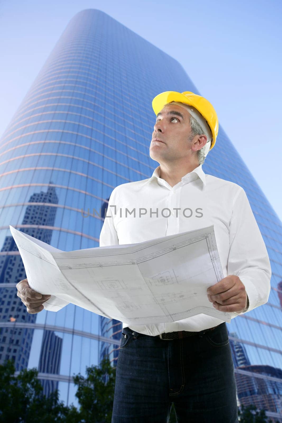 expertise architect senior engineer plan looking up city construction buildings