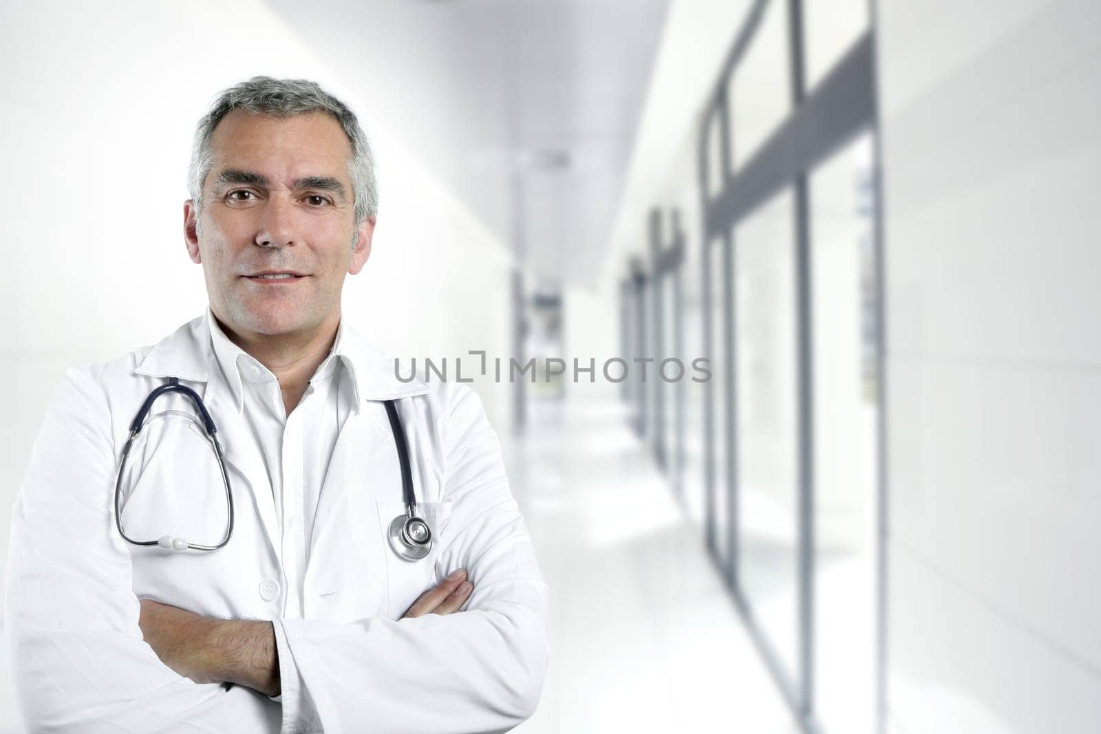 gray hair expertise handsome senior doctor hospital portrait white corridor