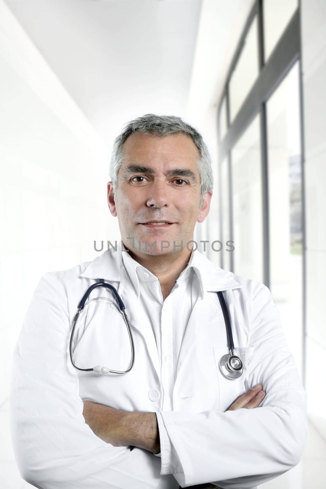 gray hair expertise handsome senior doctor hospital portrait white corridor