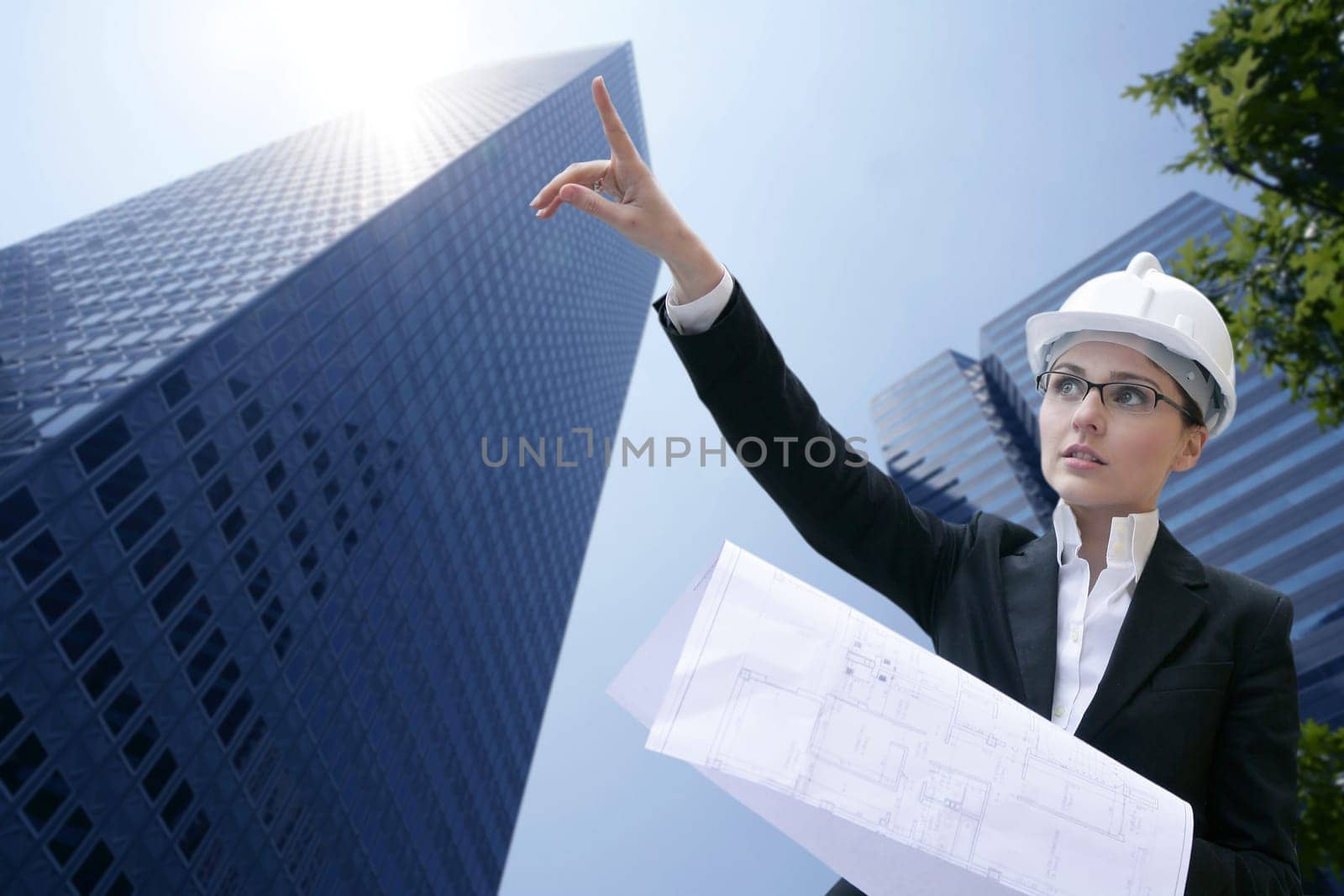 architect woman working outdoor with modern buildings