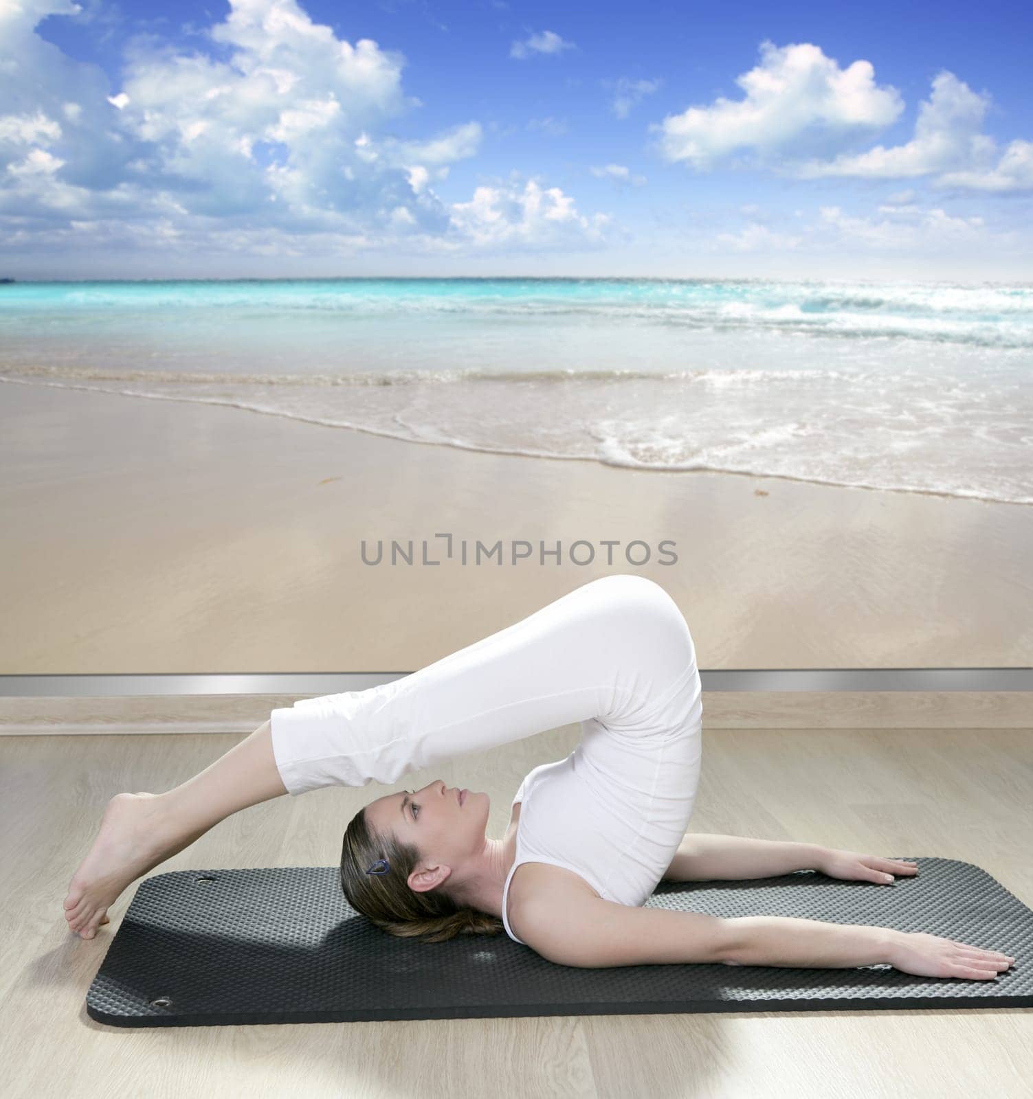 black mat yoga woman window view of tropical beach caribbean sea
