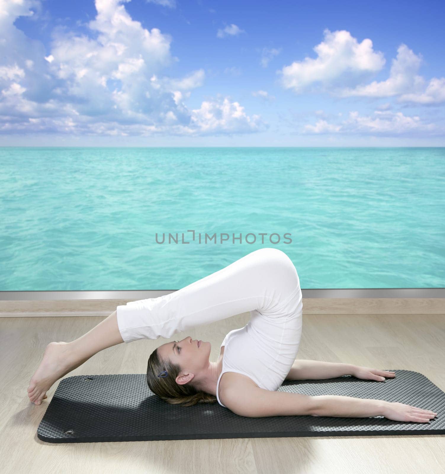 black mat yoga woman window turquoise sea view tropical caribbean