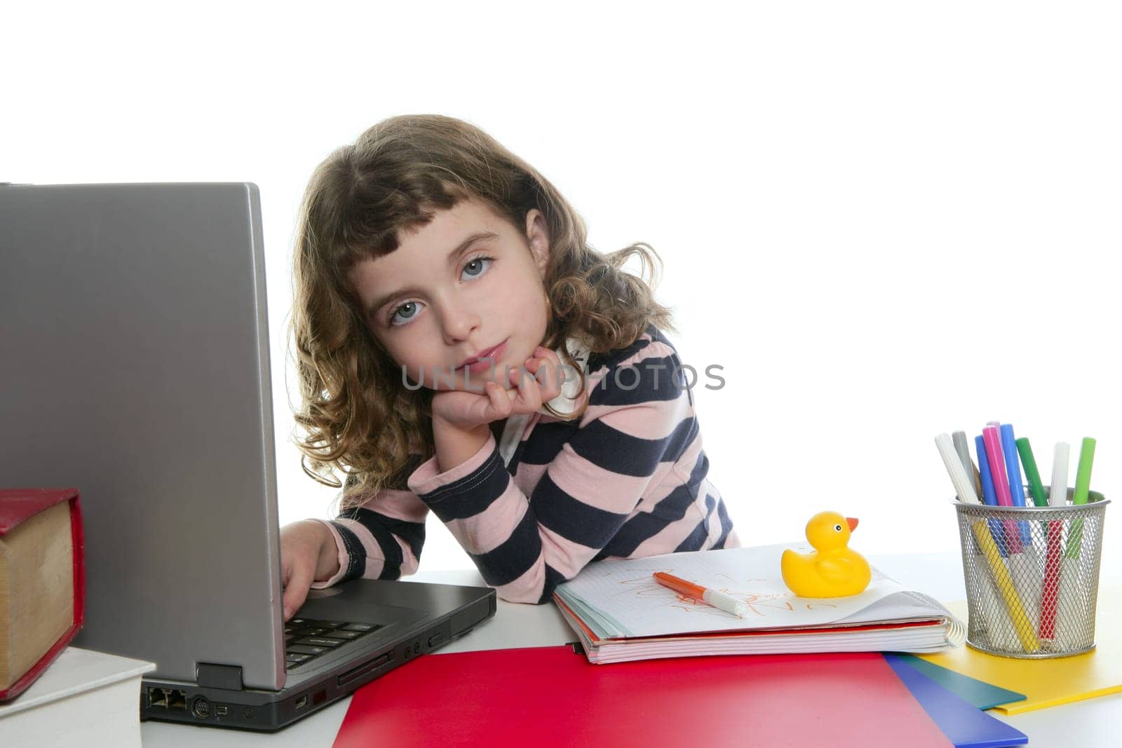 books and laptop desk with little girl student posing portrait
