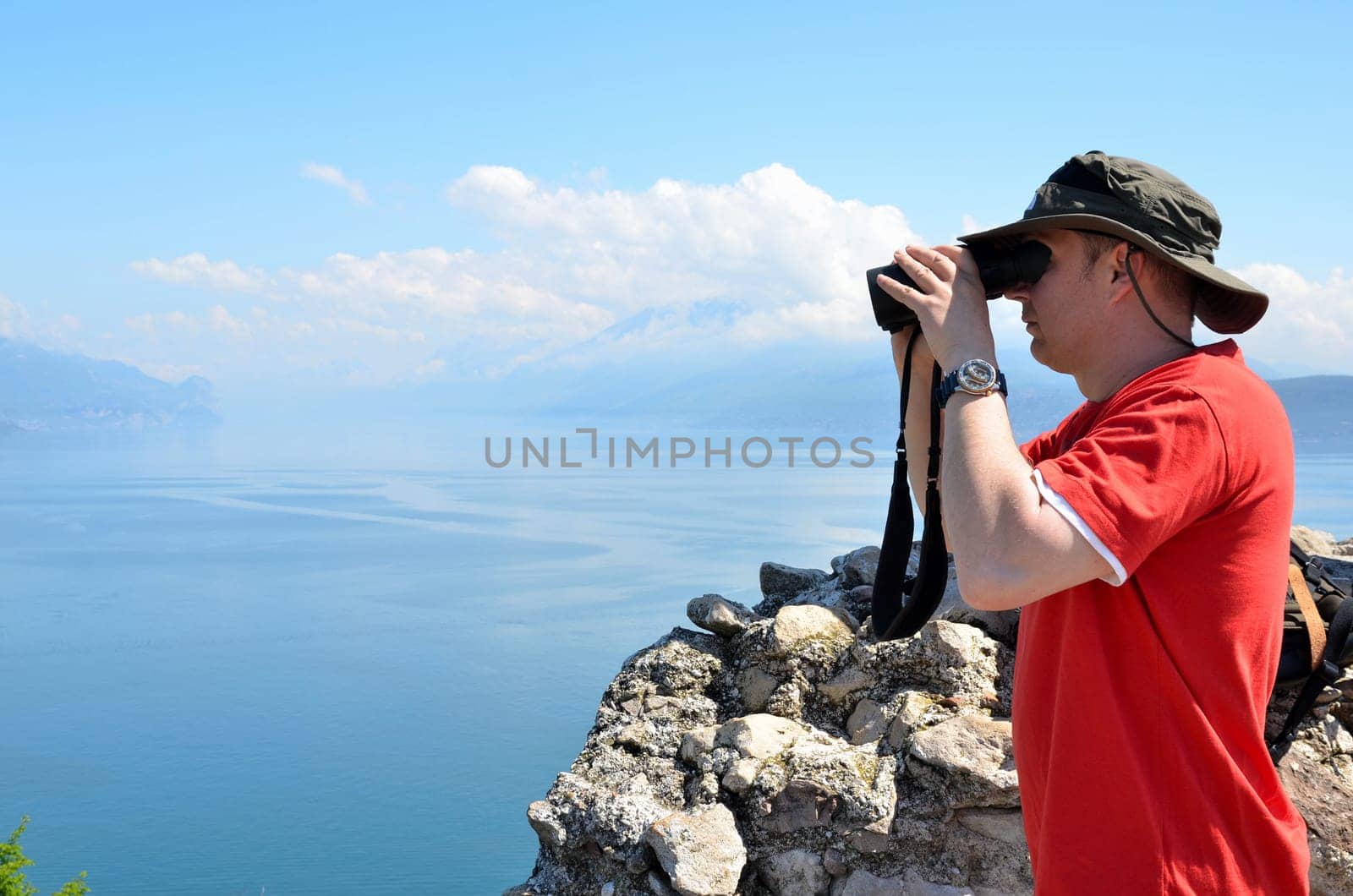 Man looking through binoculars