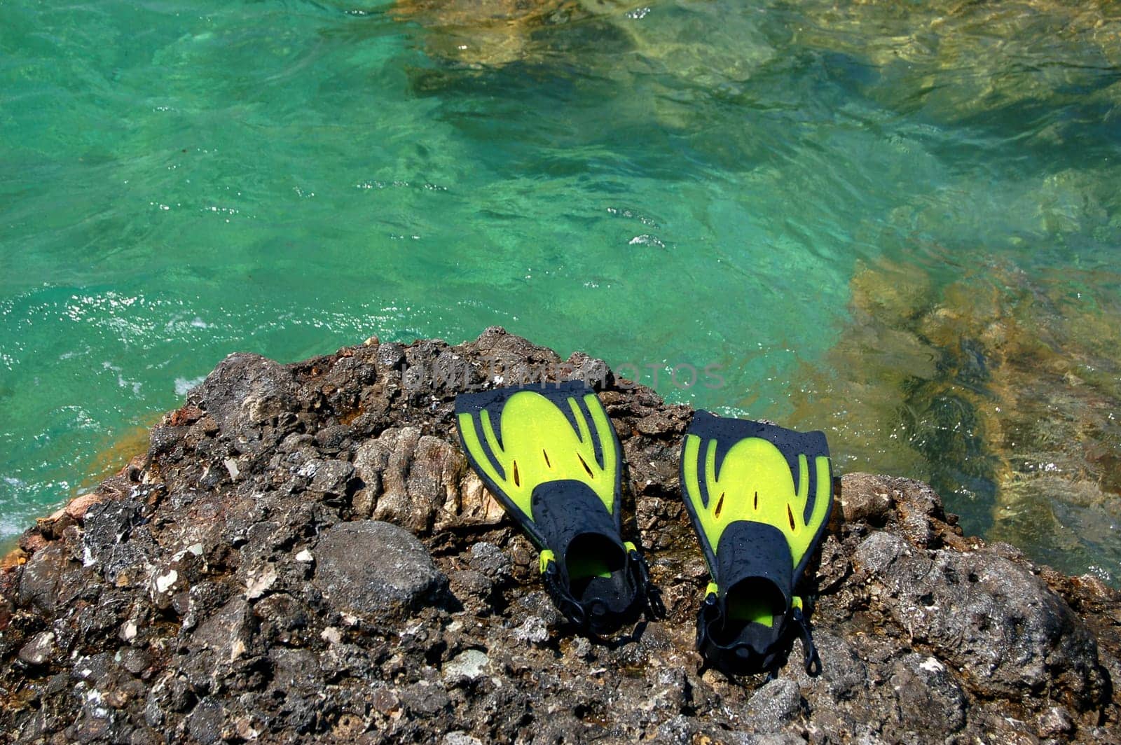 Snorkeling set on a rocky beach