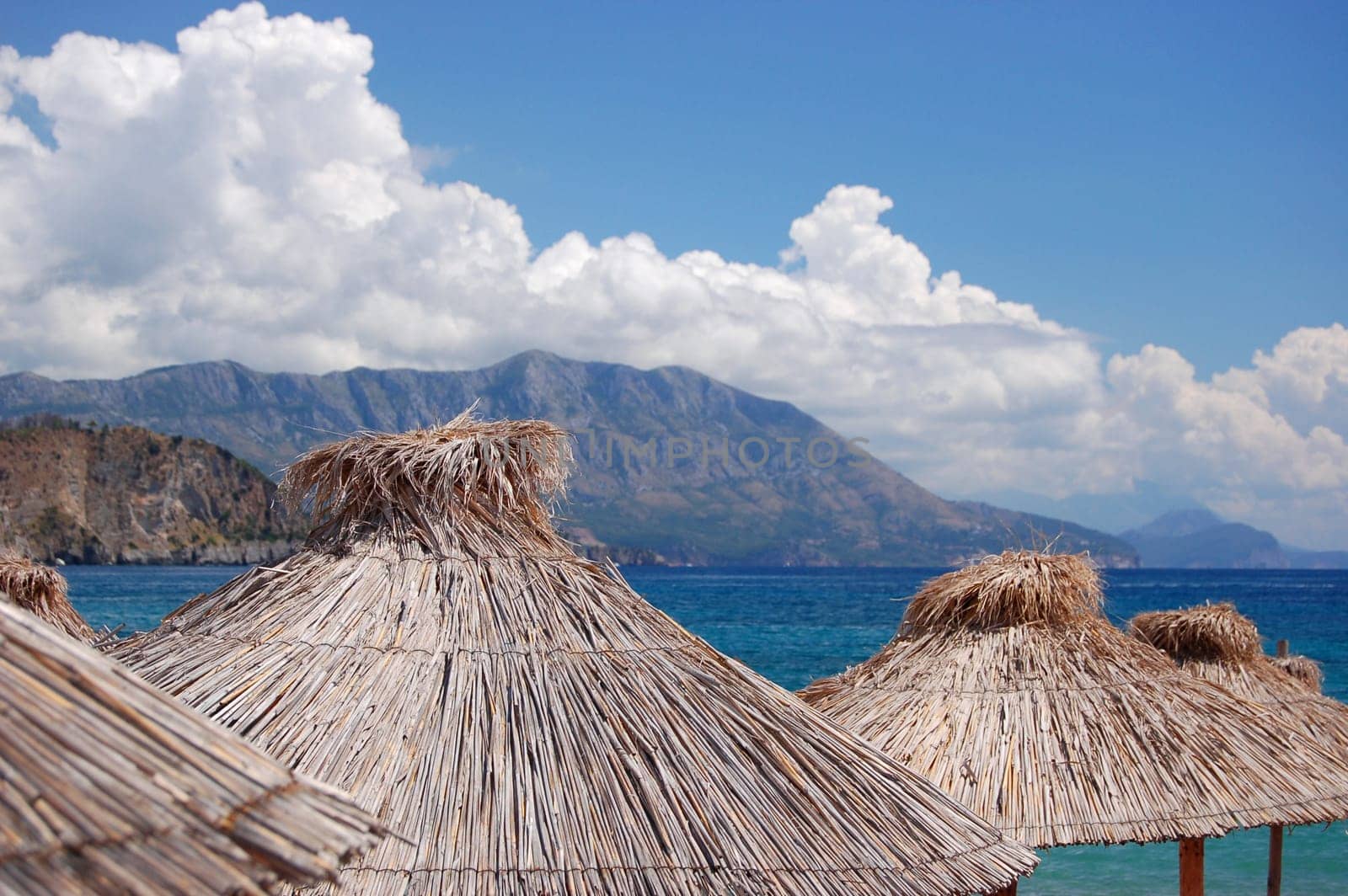 Straw umbrellas on Montenegrin beach