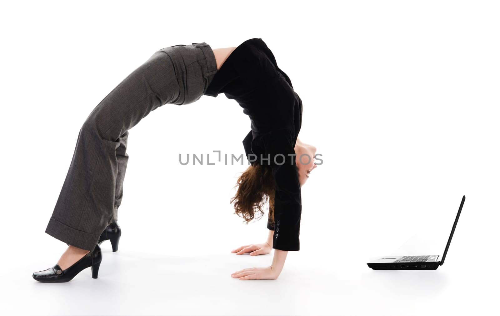 business woman arching her back on white