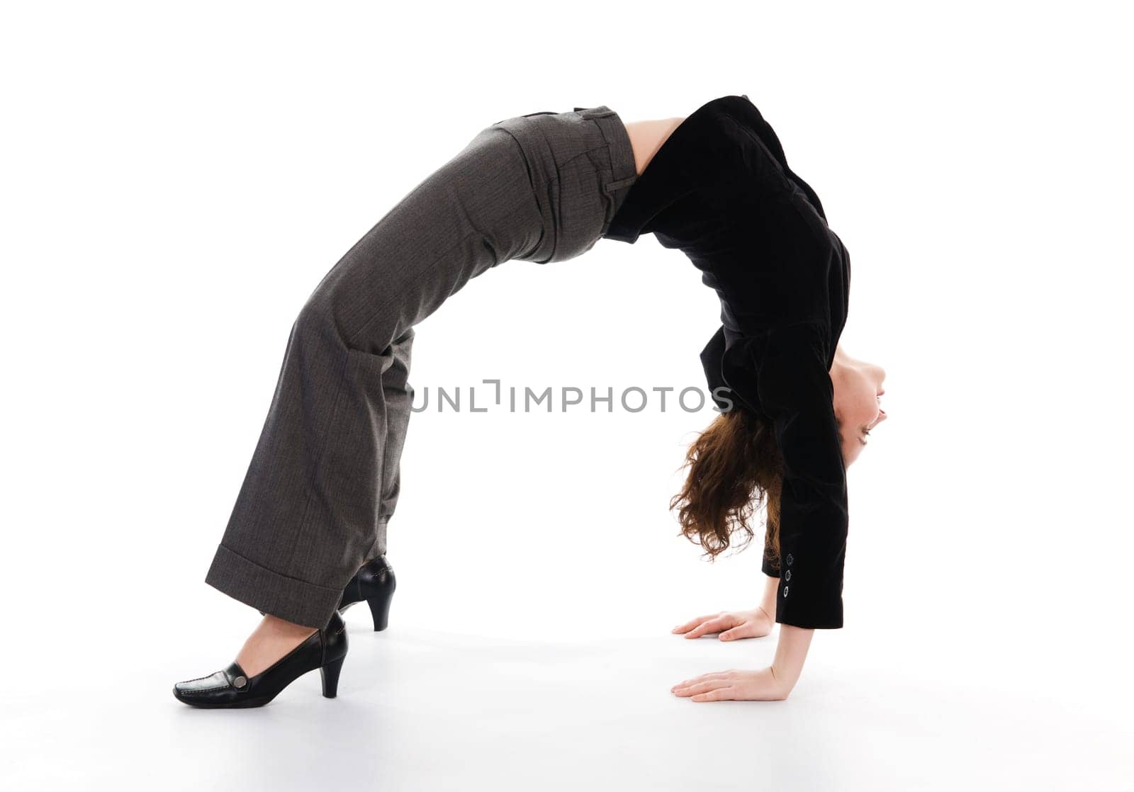 business woman arching her back on white
