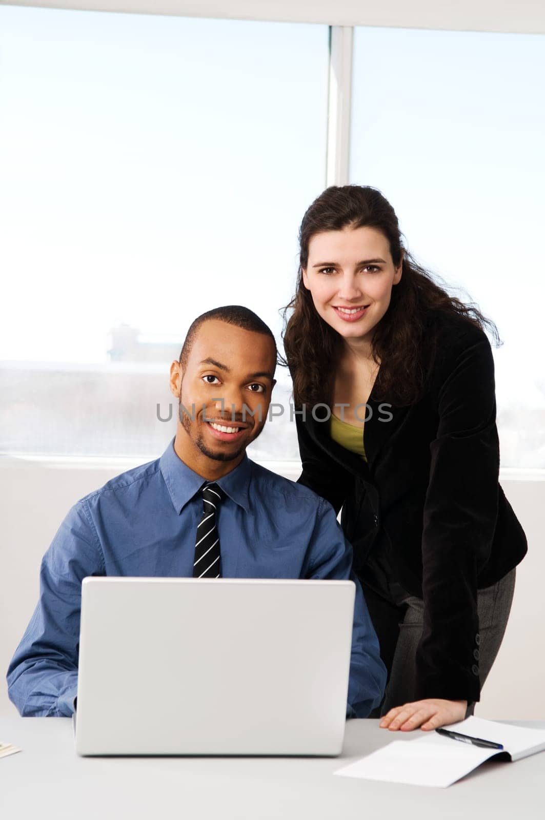 male and female business partners in a window office