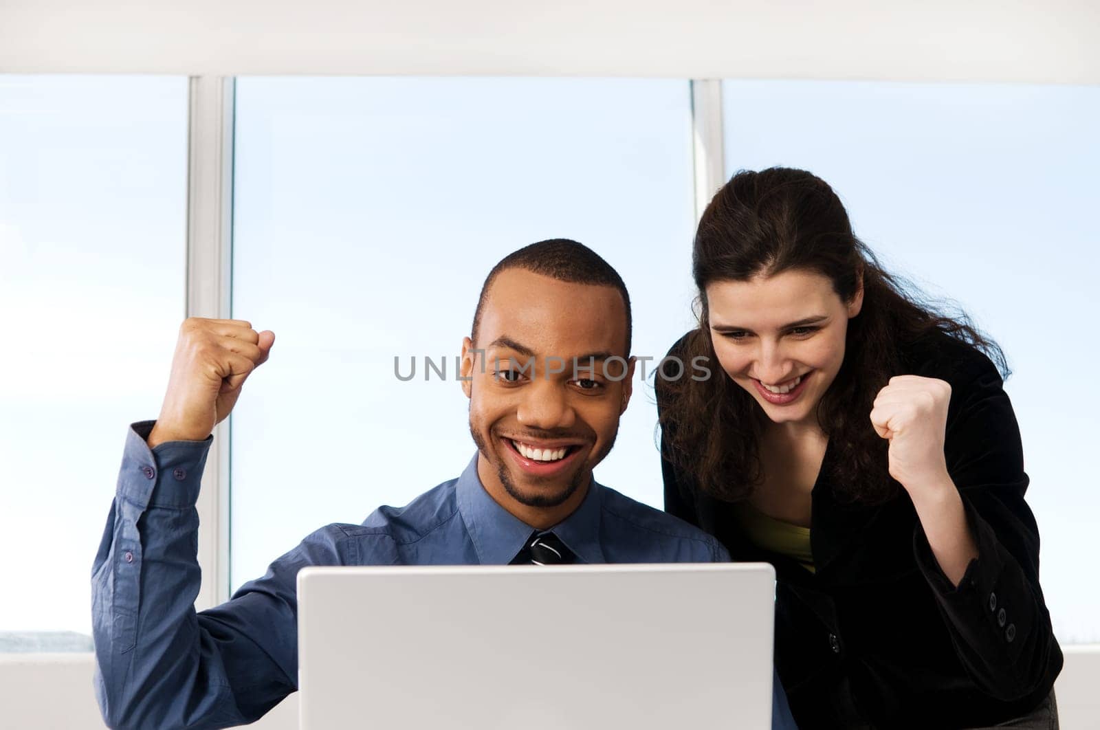 male and female business partners in a window office