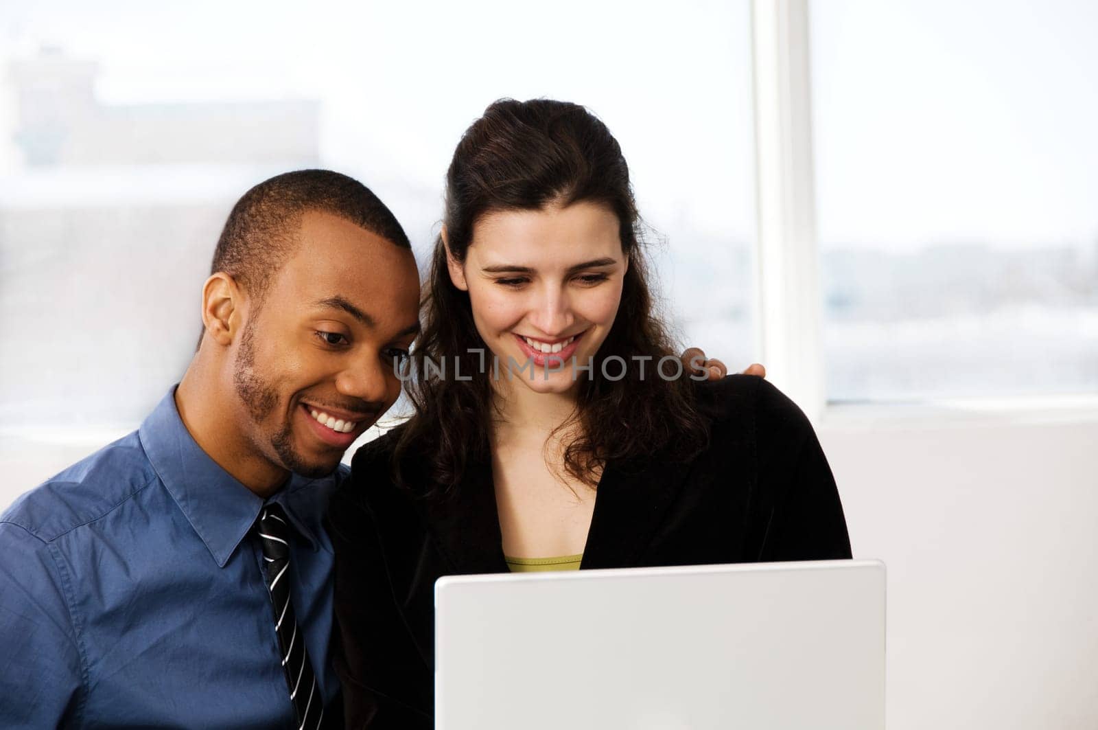 male and female business partners in a window office