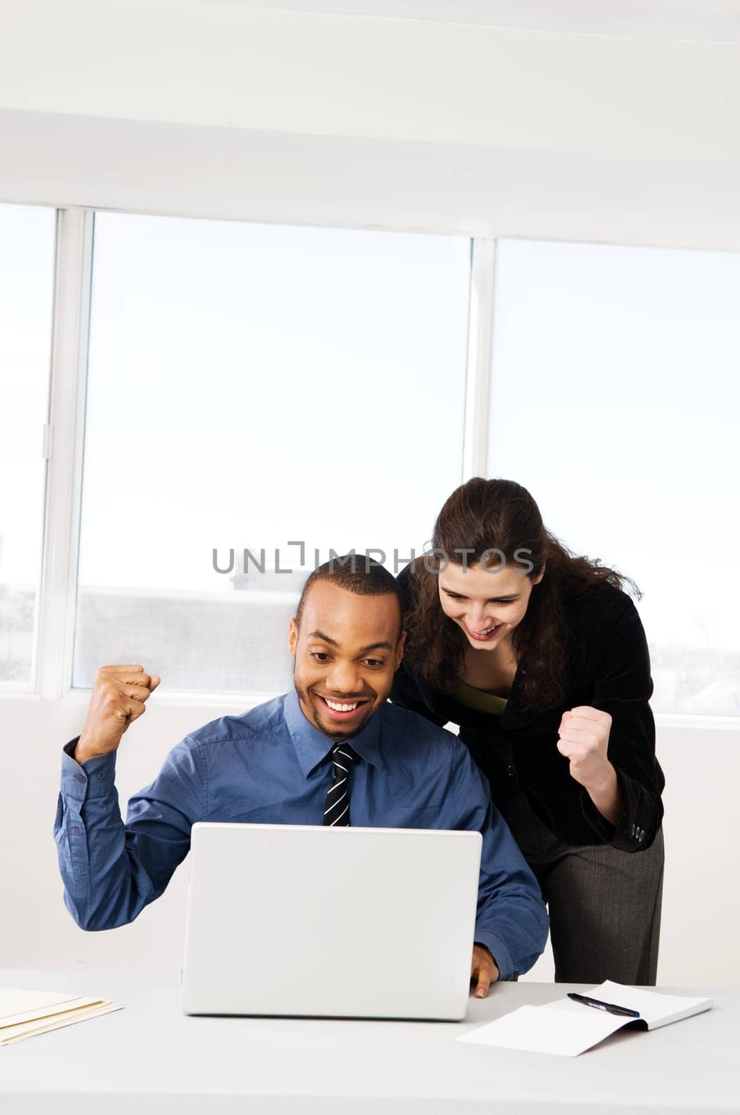 male and female business partners in a window office