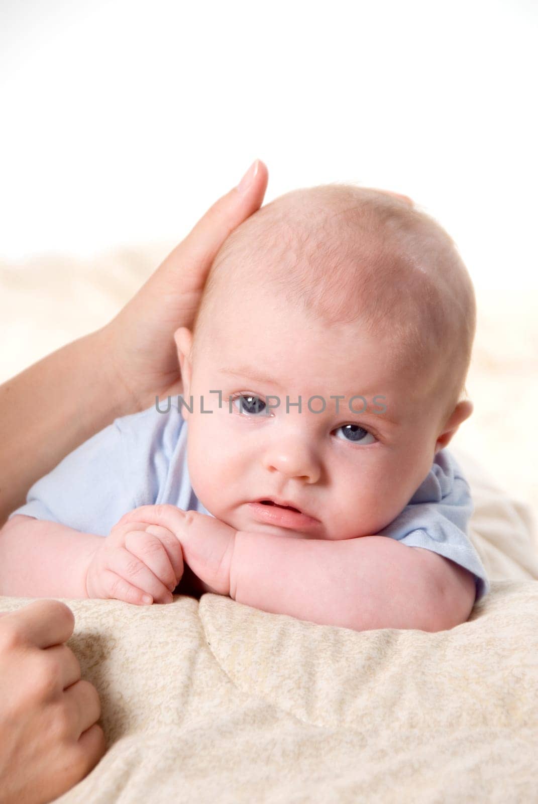 new born baby boy with the hand of the mother