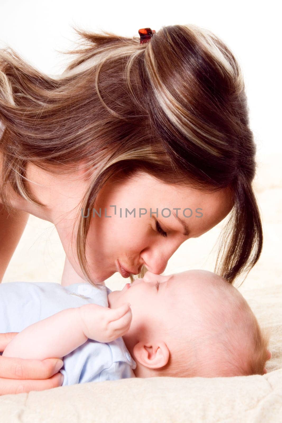 mom and her blue yed baby boy playing around
