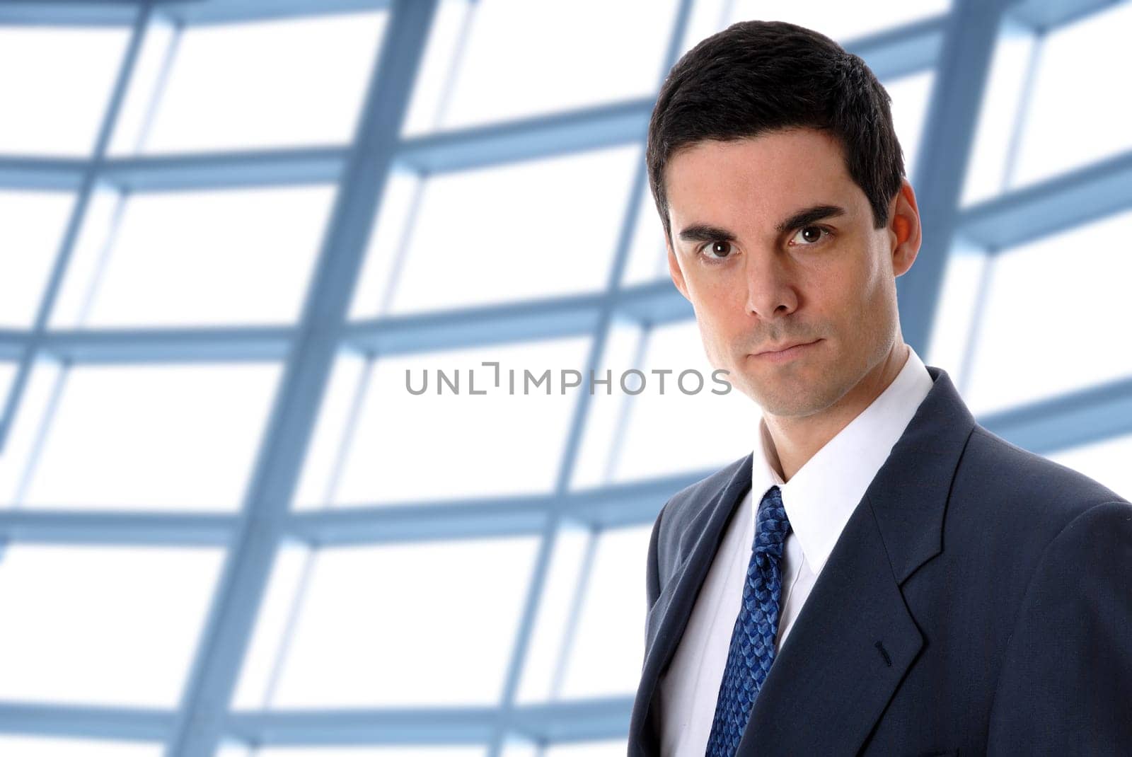 business man in an office environment with windows