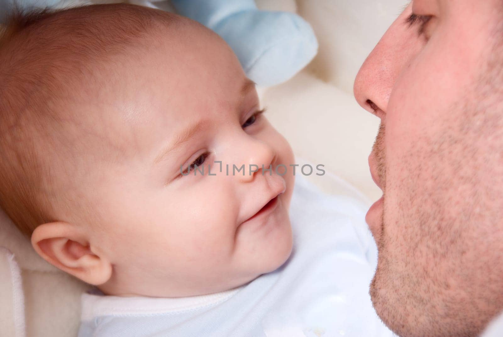dad playing with his cute baby boy