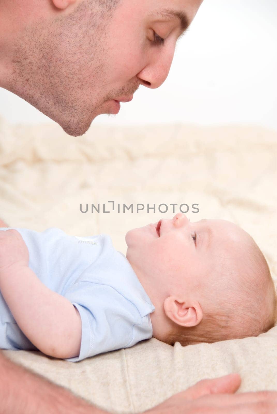 dad playing with his cute baby boy