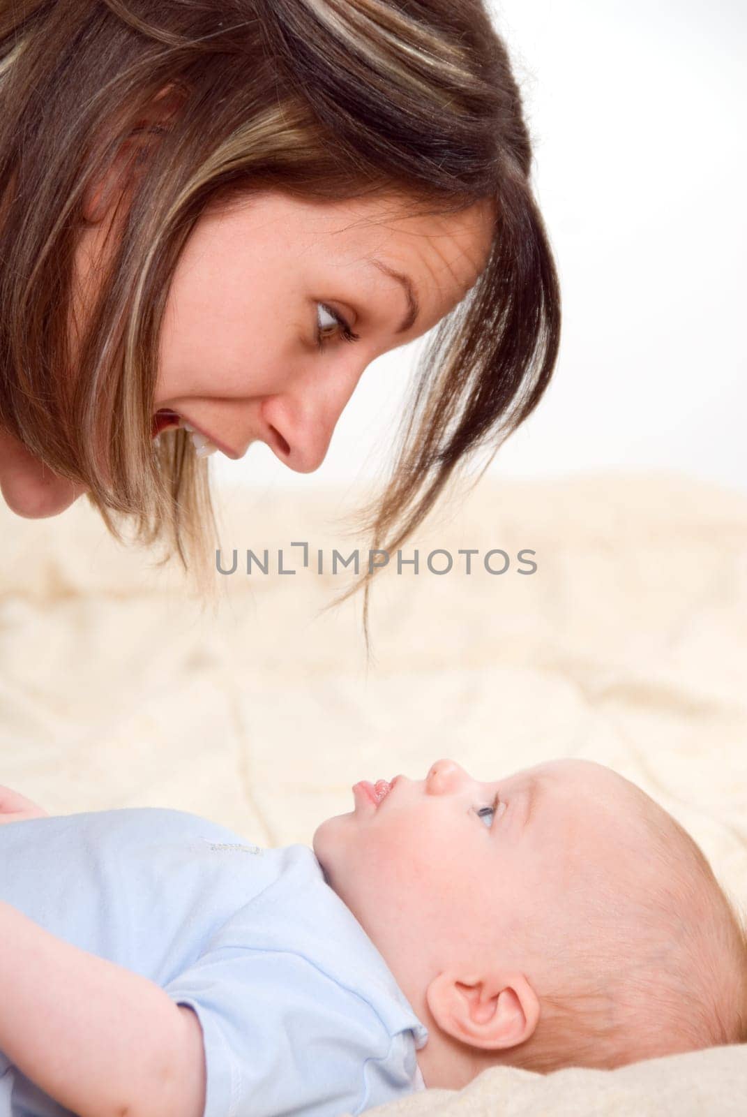 baby boy grimacing at his surprised mom