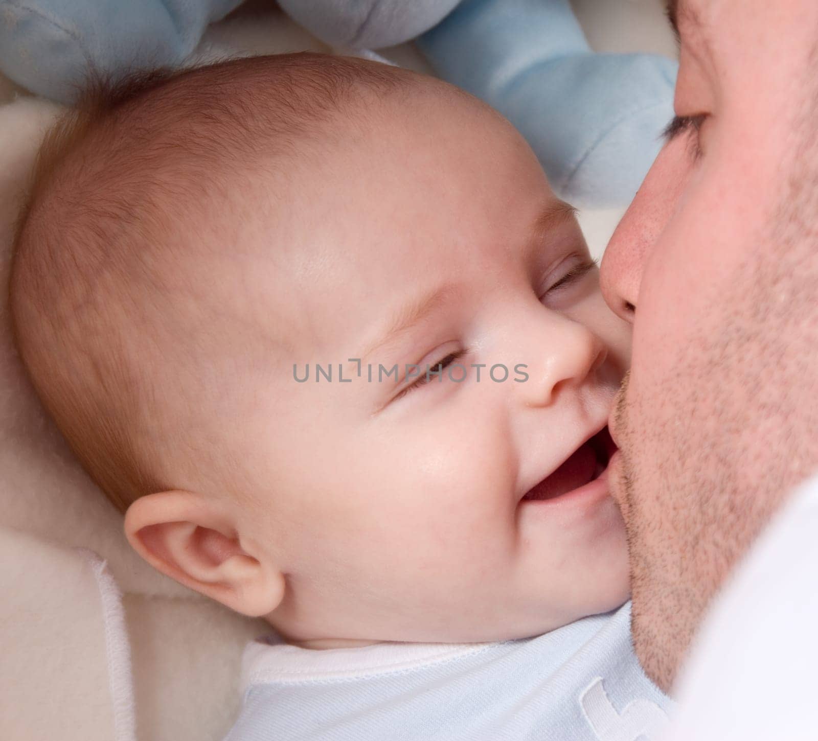 dad playing with his cute baby boy