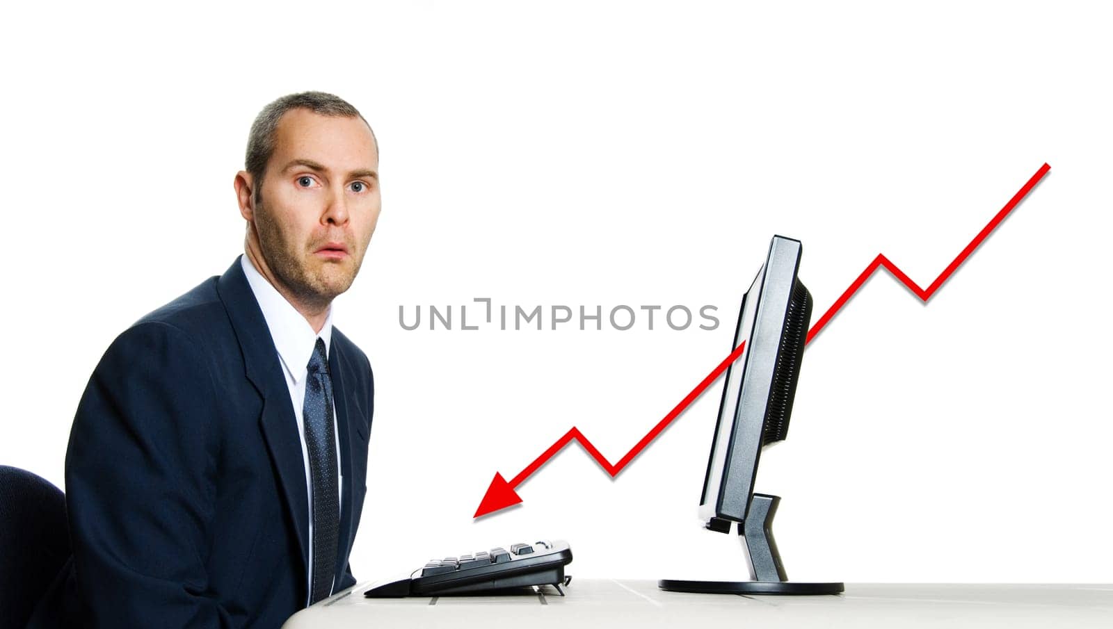 unhappy man in blue suit at office computer financial crisis