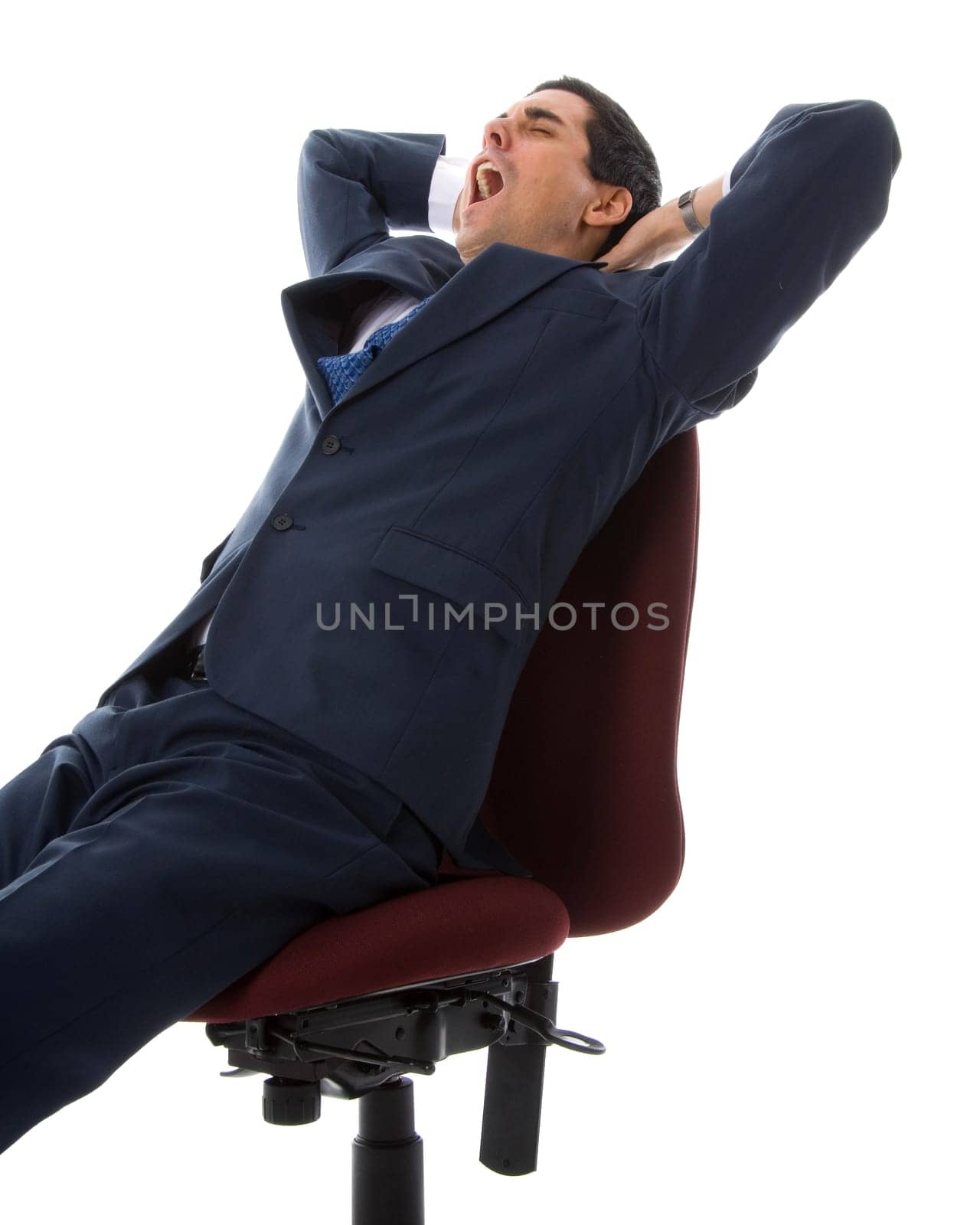 yawning man in a blue suit on a chair