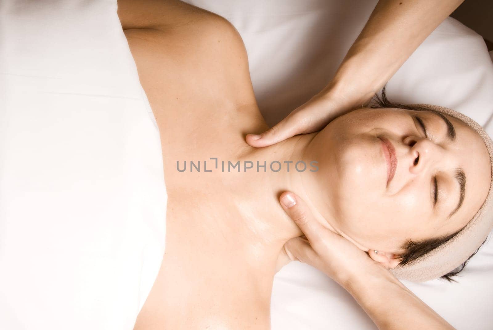 woman relaxing with a nice facial massage