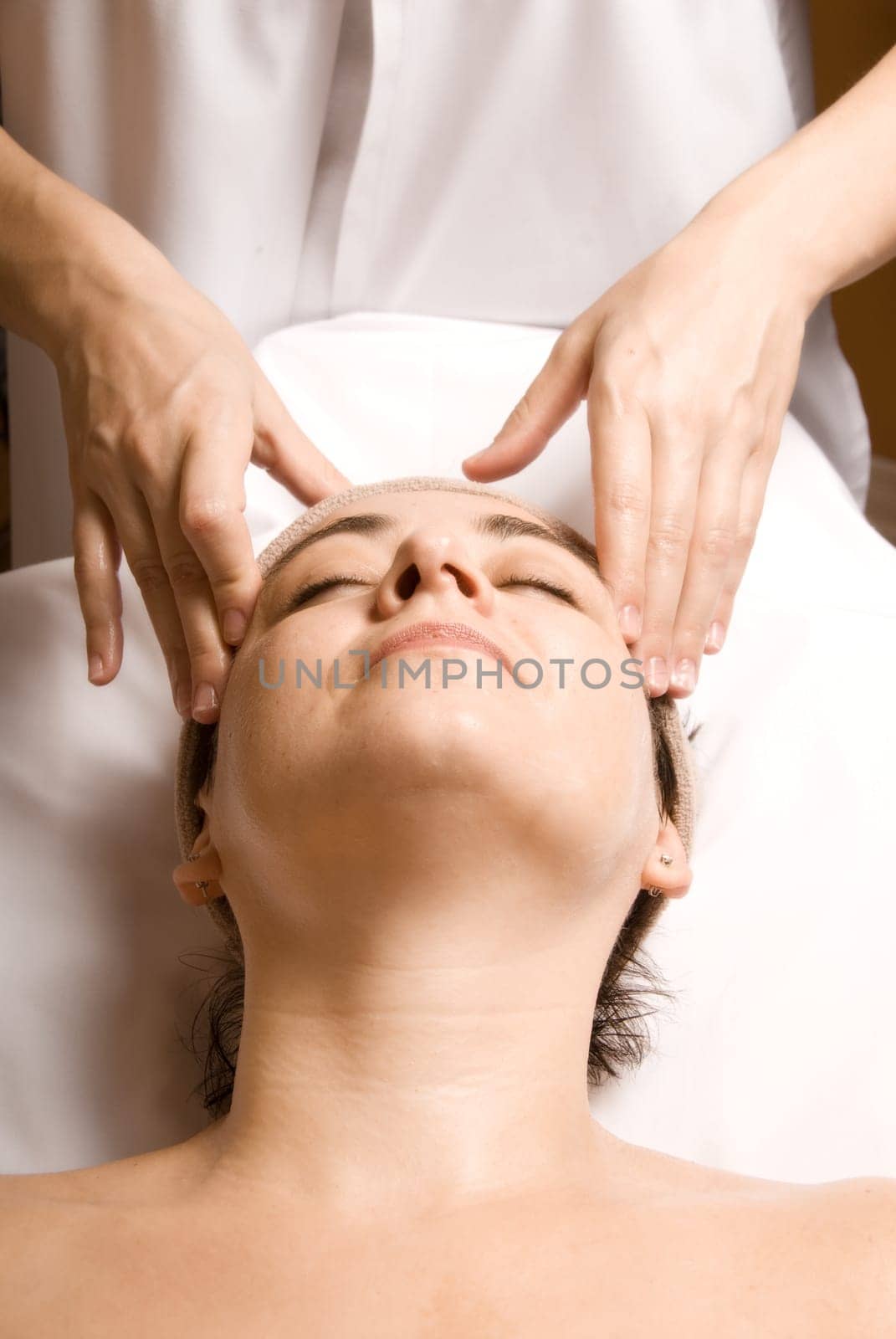 woman relaxing with a nice facial massage