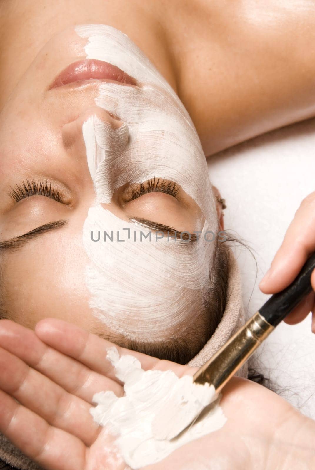 woman relaxing with a nice facial massage