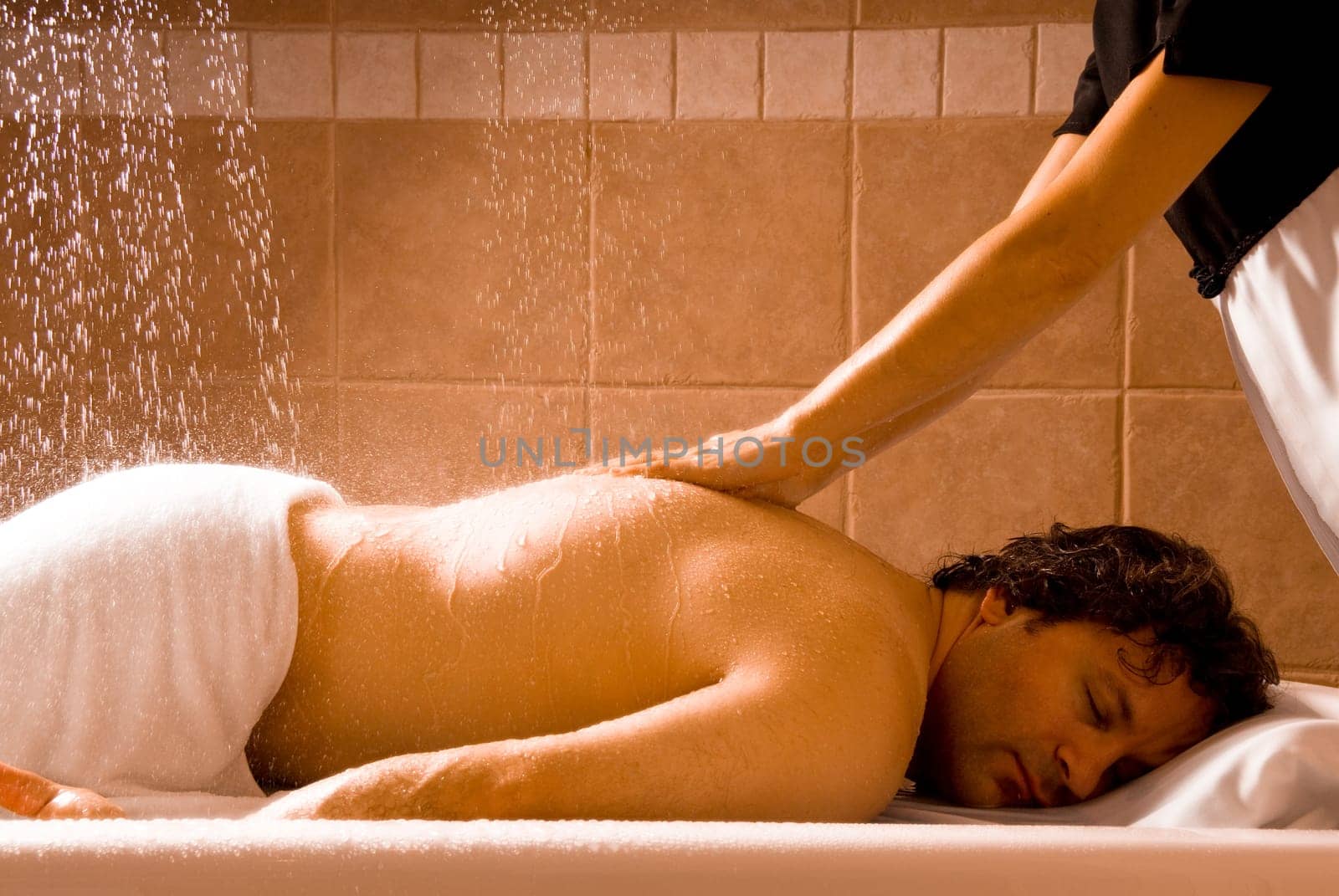 happy relaxing man getting a hydro massage