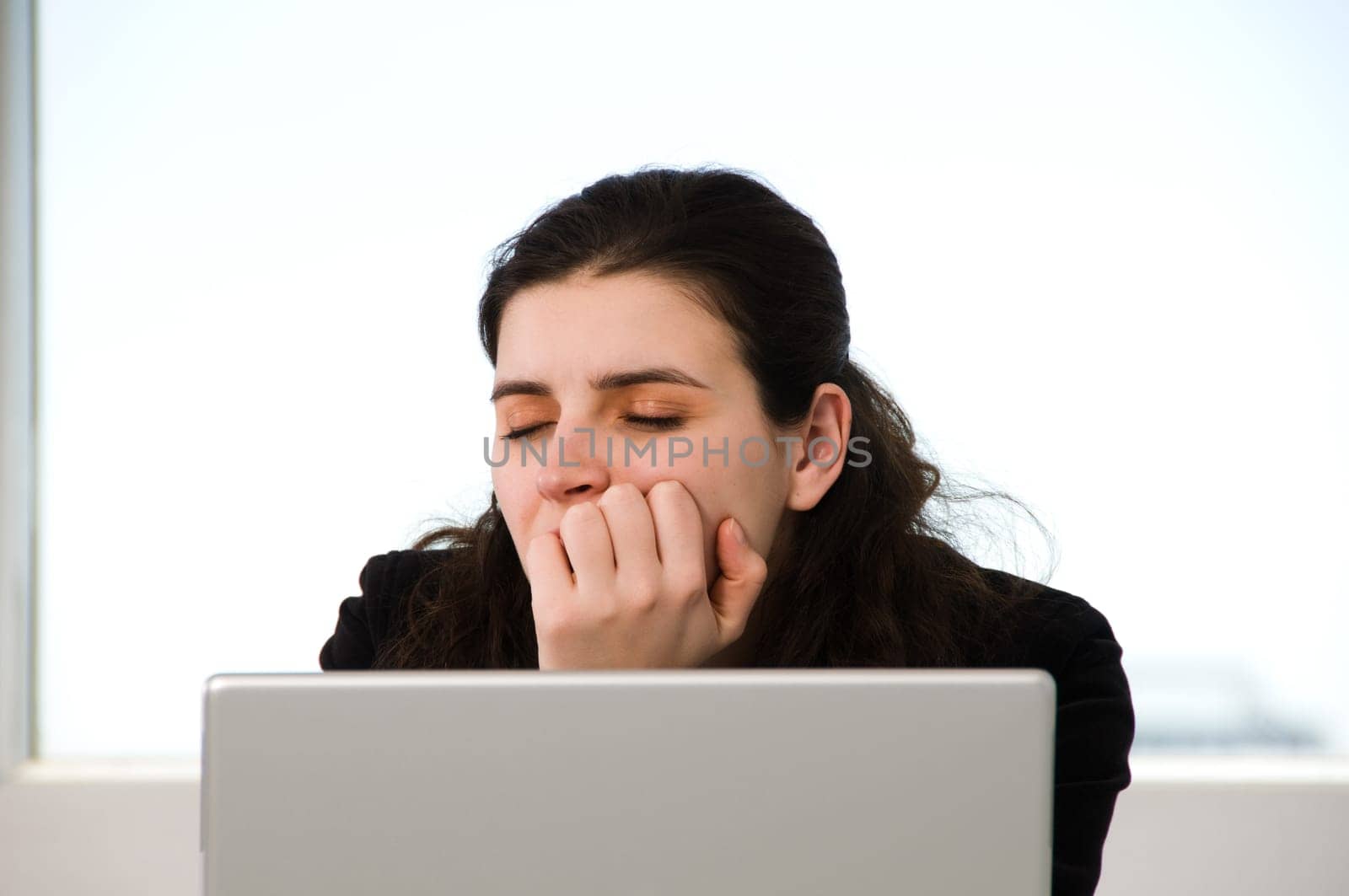 business woman sleeping on the job at work