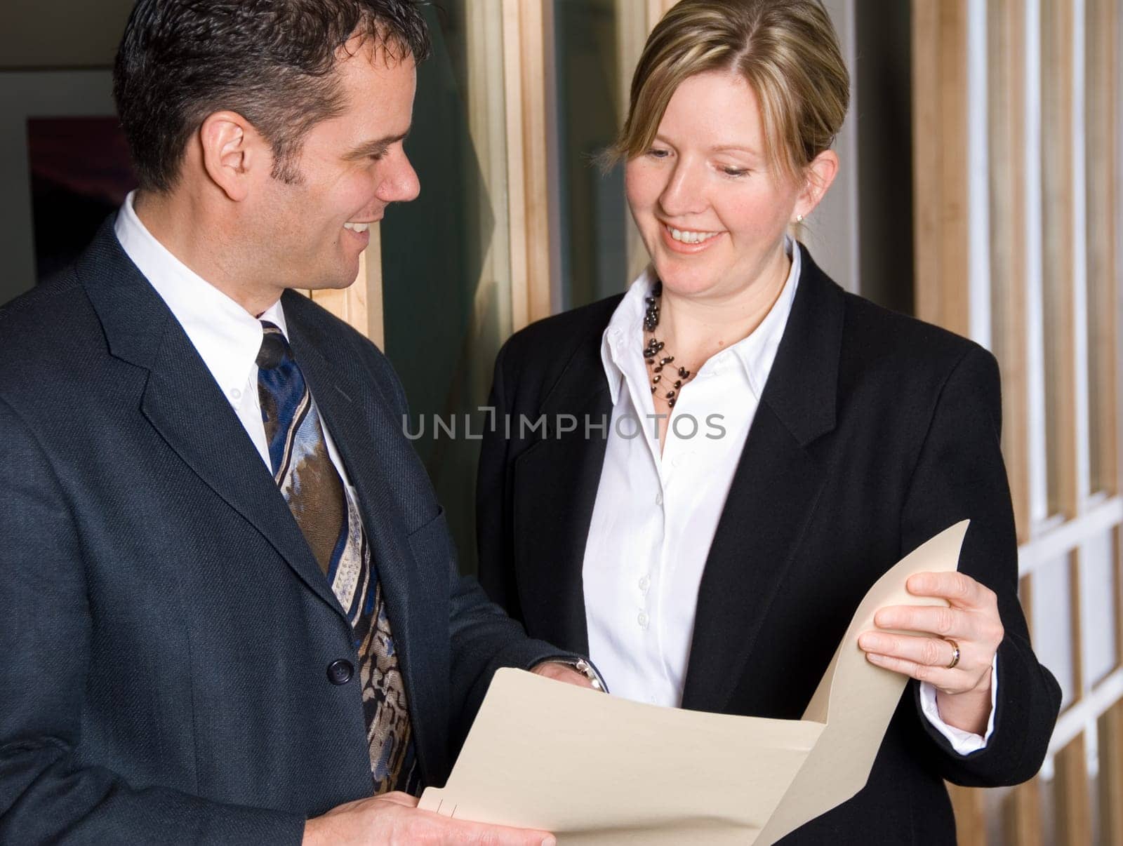 two business people looking at some files